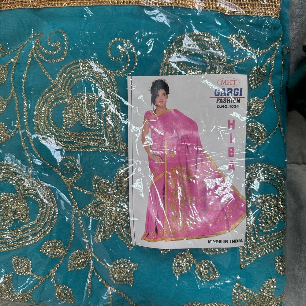 Gargi Fashion Teal and Gold Embroidered Fabric